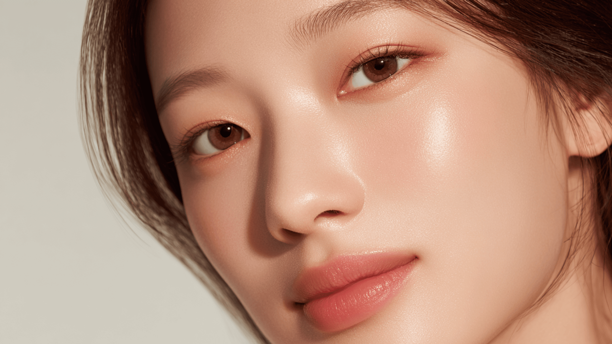 close up portrait of woman with glowing skin natural makeup and soft lighting beauty shot