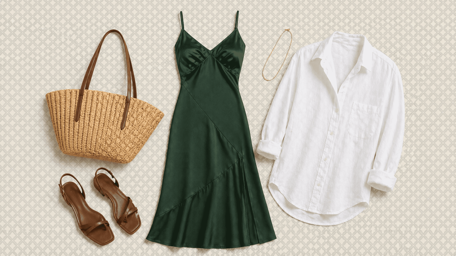 Green satin slip dress outfit flat lay with white shirt, brown sandals, woven tote and gold necklace on soft patterned background (1)