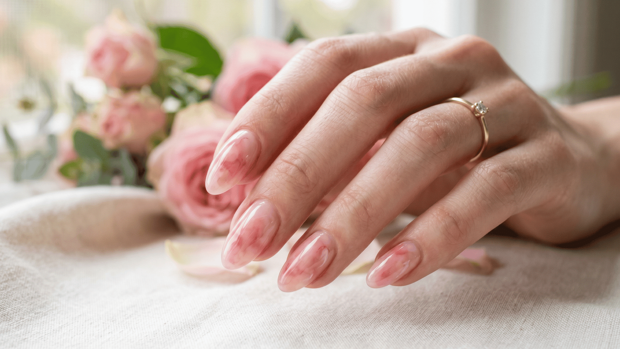 soft blush tint nails with sheer pink tone and glossy natural finish