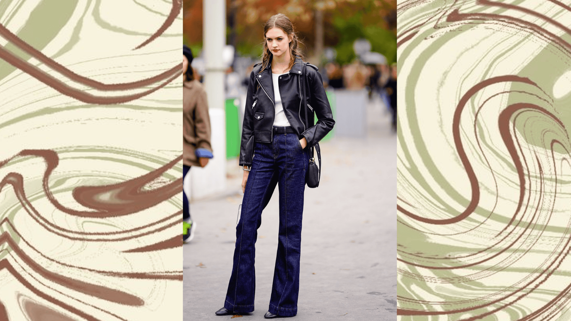 street style black leather jacket over white tee with dark navy bootcut jeans and black pointed flats