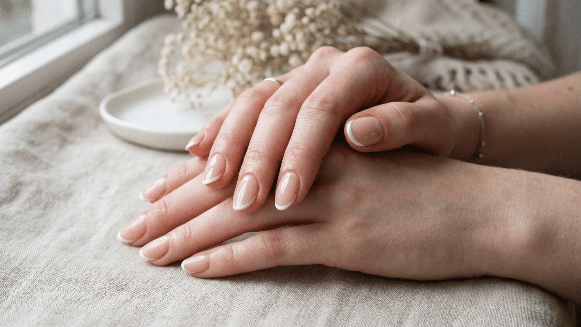 thin french tip nails with classic clean glossy finish