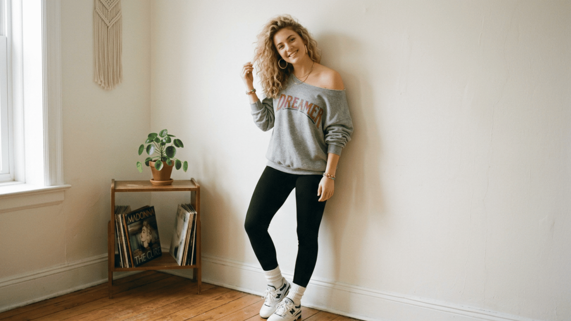 woman posing indoors in cozy casual outfit with soft lighting and minimal decor background