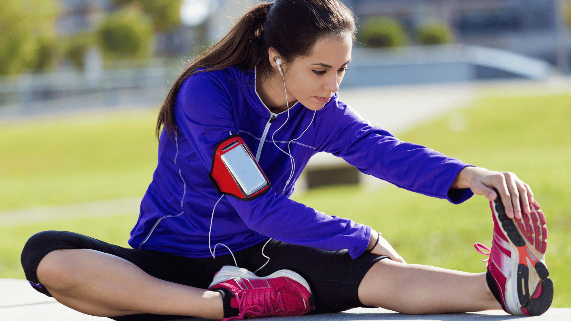 woman stretching outdoors before exercise showing physical activity.