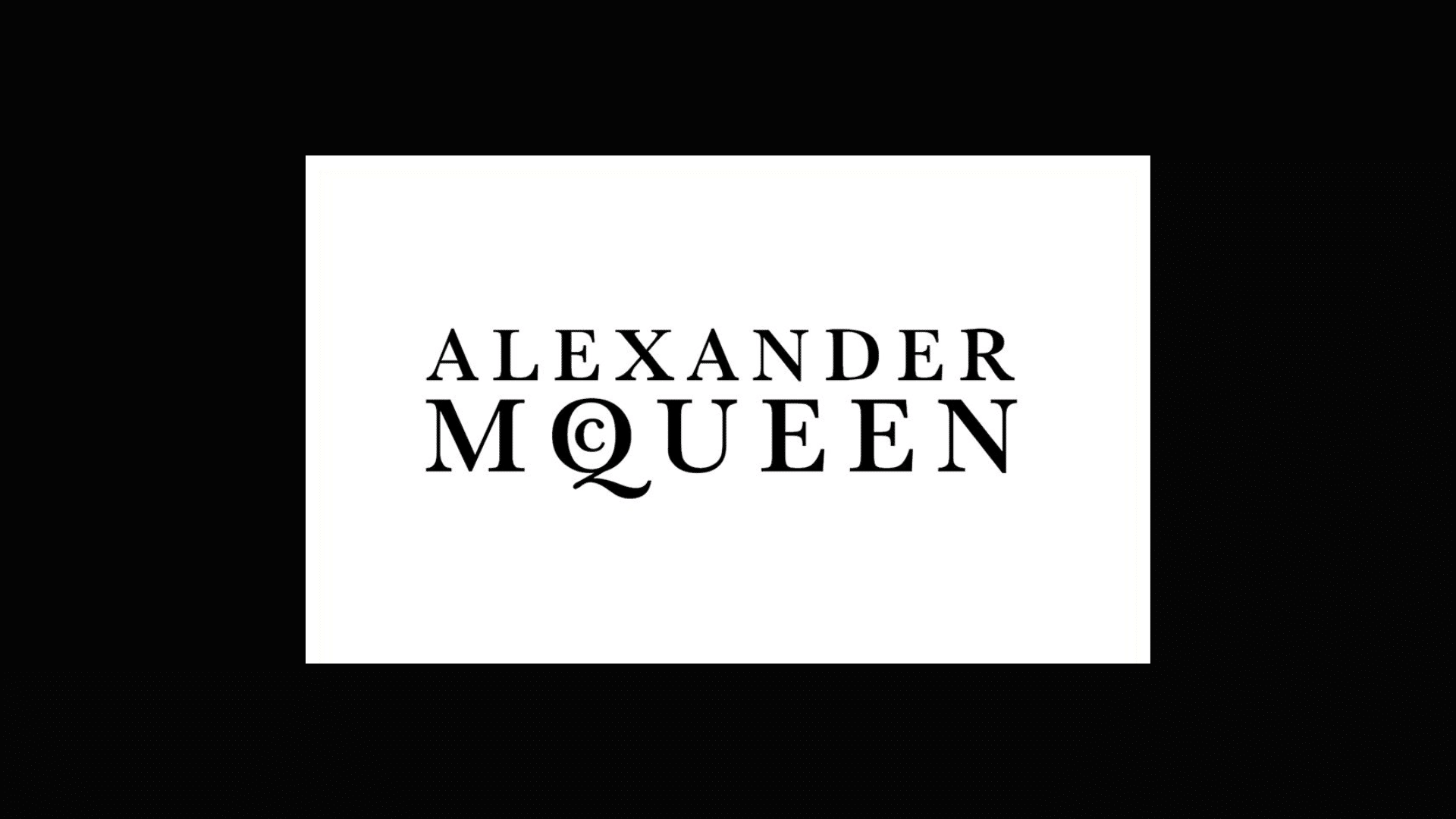 alexander mcqueen logo with black backdrop