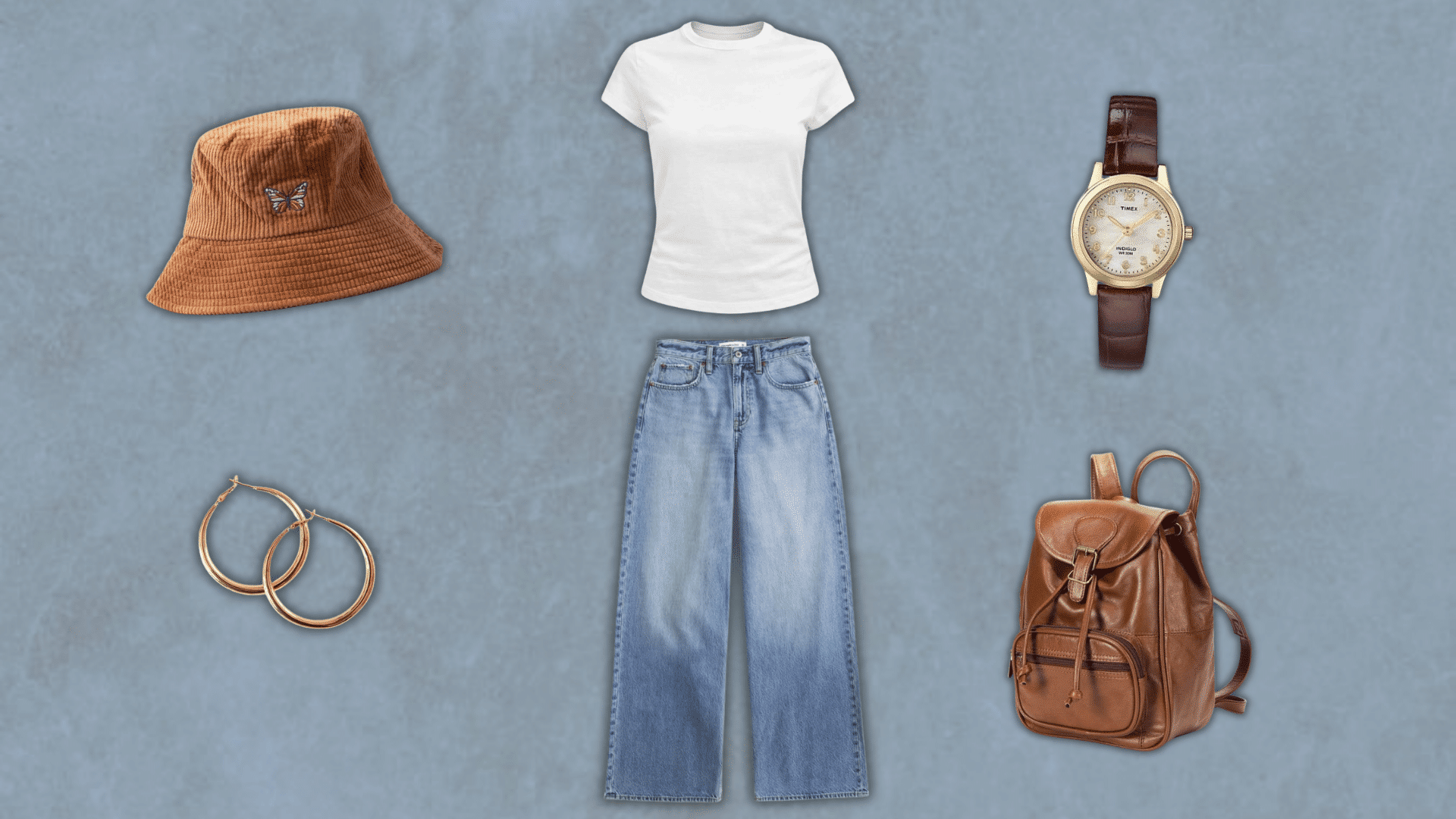 90s bucket hat outfit with plain tee jeans and a leather backpack from the blog