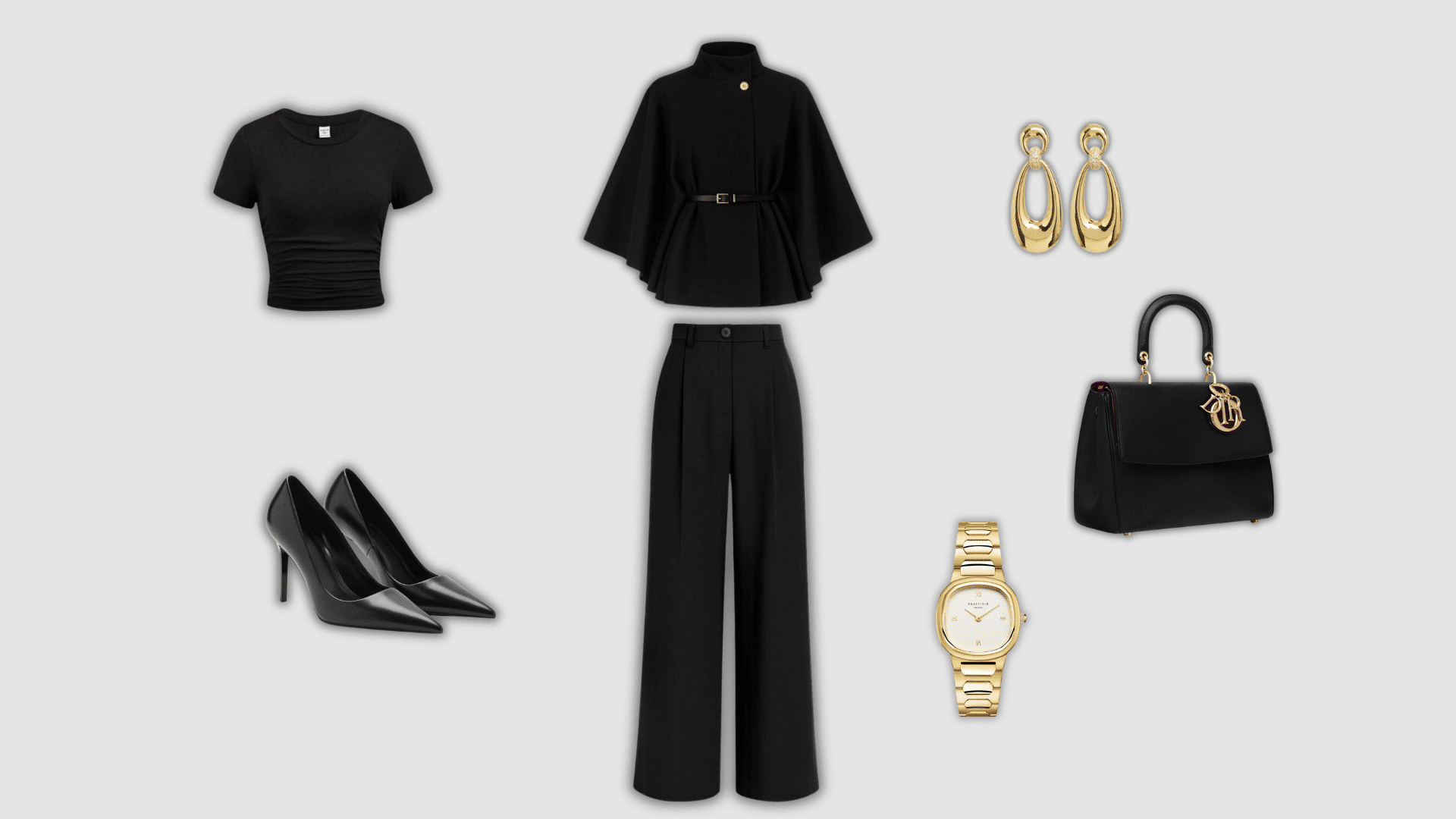 black monochrome outfit with cape coat wide leg pants heels and handbag