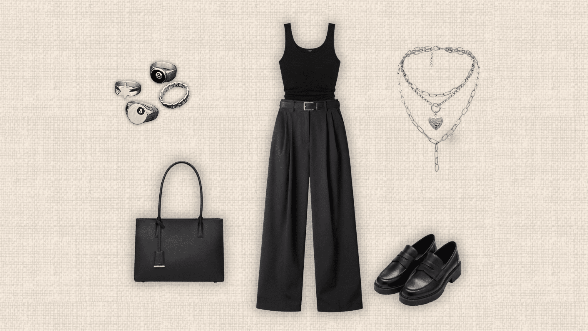 black fitted tank tucked into black wide leg trousers with loafers structured tote silver jewelry and layered necklaces