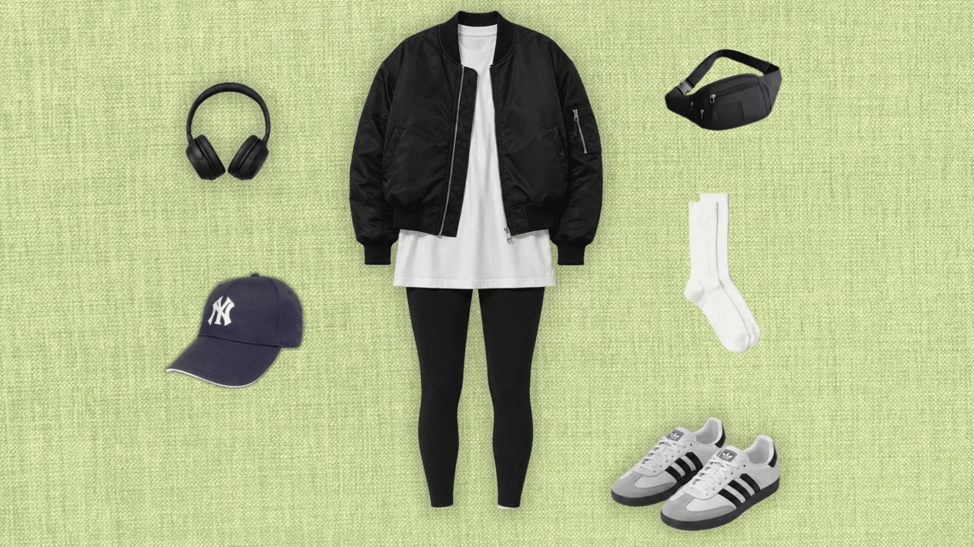 black bomber jacket over an oversized white tee with black leggings sneakers cap belt bag and headphones for an athleisure look