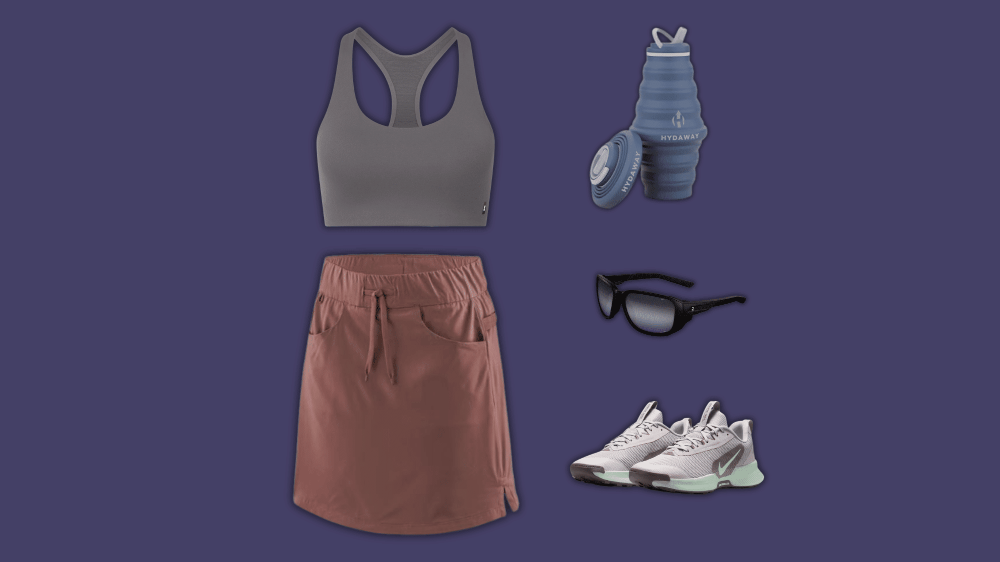 gray sports bra and rust skort with trail accessories