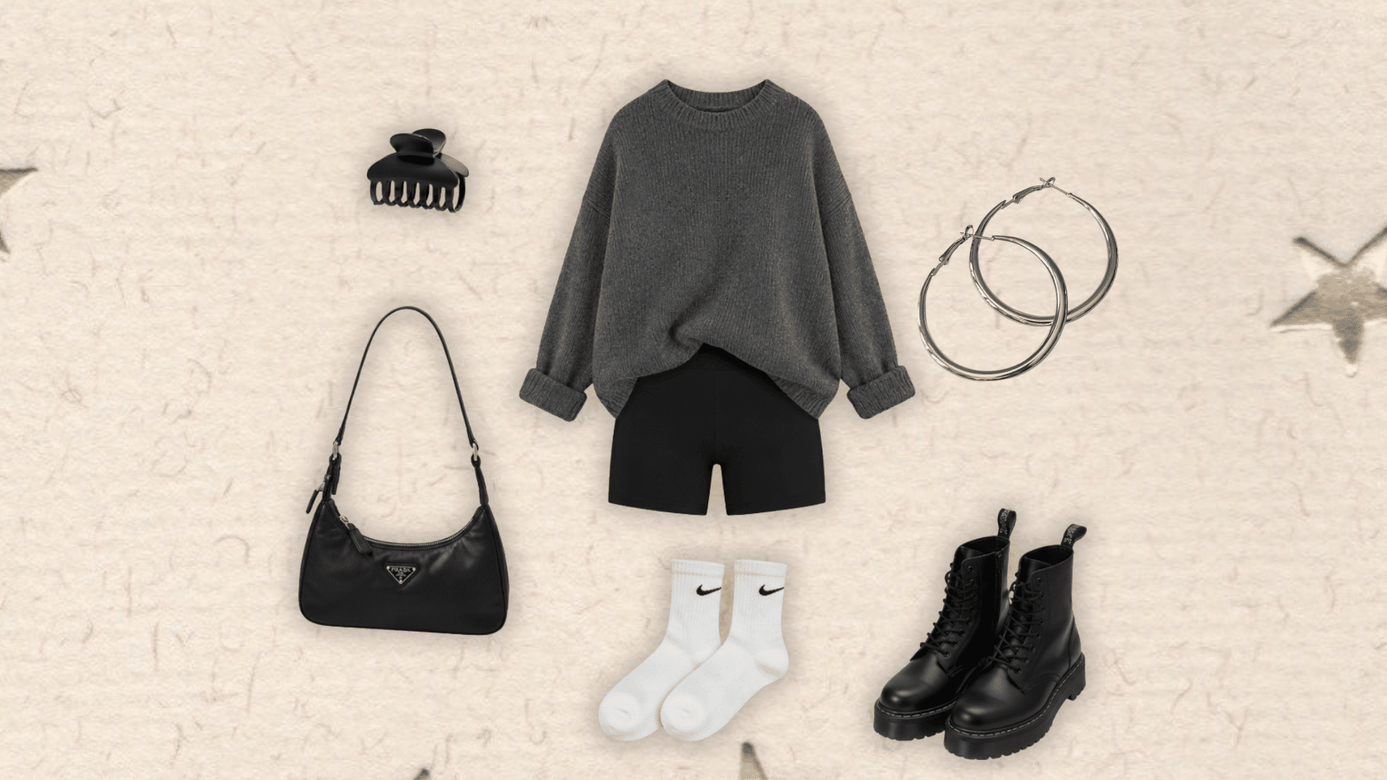 oversized gray knit sweater styled with black biker shorts combat boots shoulder bag white socks silver hoops and claw clip