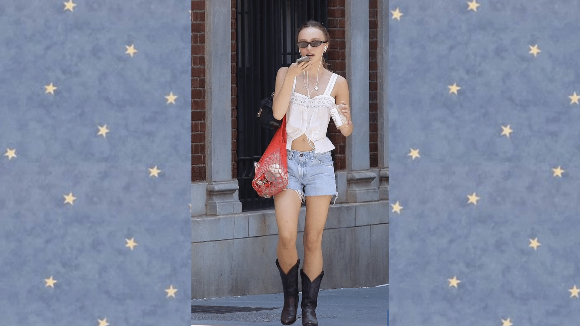 lily rose depp wearing a white lace camisole denim shorts black cowboy boots and mesh tote bag for a casual summer street style look