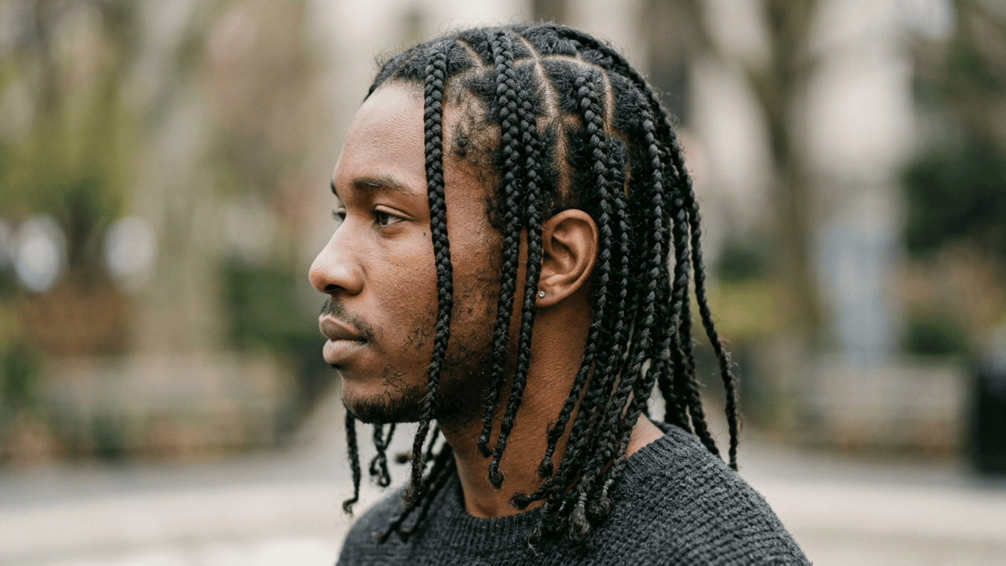 side profile of man wearing long box braids