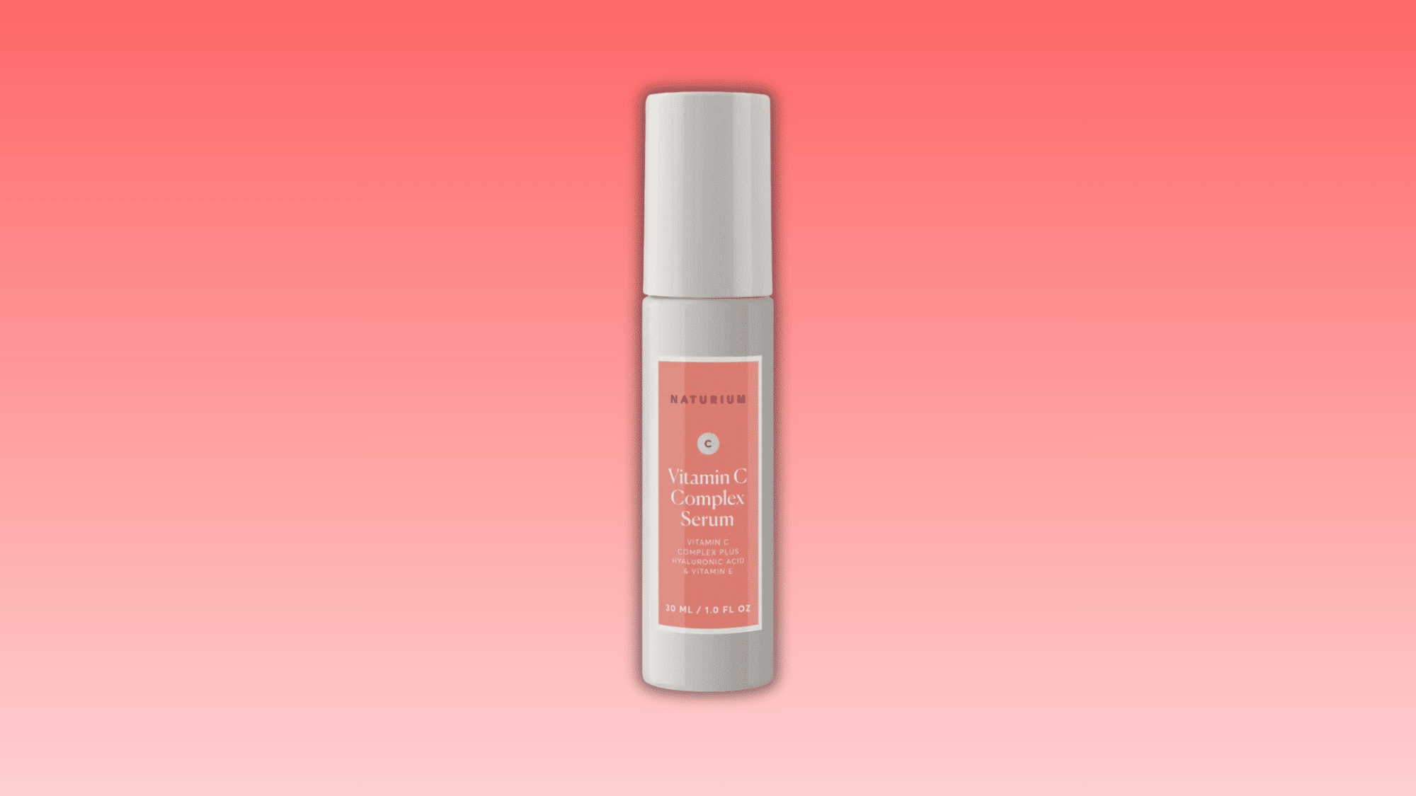 naturium vitamin c serum bottle on pink background