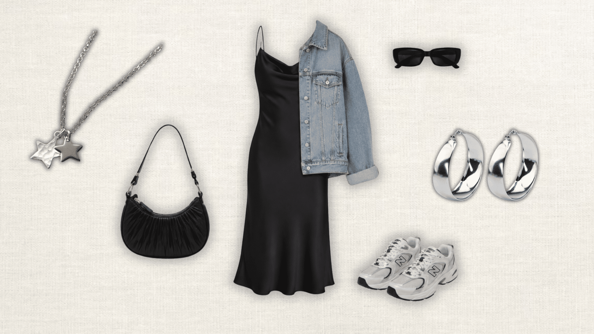 black satin slip dress layered with a blue denim jacket chunky sneakers shoulder bag silver earrings and star pendant necklace